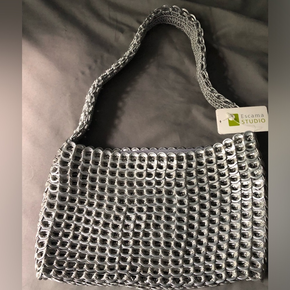 Cute handbag mad out of aluminum pull tabs.